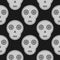 Grey skull on a black background. Seamless pattern.