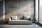 Grey sofa against window in grunge room with concrete walls. Loft home interior design of modern living room