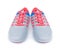 Grey sports shoes with pink shoelaces