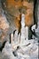 Grey stalagmites formed by mineral deposits and dripping water