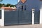 Grey steel classic old vintage portal style metal driveway entrance gate access entry