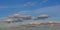 Grey stratocumulus clouds on a blue sky