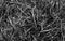 Grey straw background texture, gray thatch heap, dried grass texture, hay