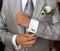 Grey suit of a groom with boutonniere