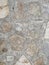 Grey textured concrete with multiple marble colour tiles pattern