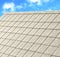 Grey tile roof of construction house with blue sky