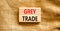Grey trade symbol. Concept words Grey trade on wooden block. Beautiful canvas table canvas background. Business grey trade concept