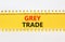 Grey trade symbol. Concept words Grey trade on yellow paper. Beautiful yellow table white background. Business grey trade concept