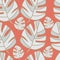 Grey tropical leaves on orange background seamless repeat.