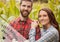 Grey and white fourth of July graphic against couple in cornfield