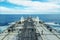 Grey and white tanker deck in blue sea