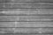 A grey wooden wall with a lot of texture from an hold small house. For any kind of background, wallpapers and desingns.