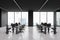 Grey workspace interior with desk and pc monitors in row, panoramic window