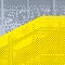 Grey and yellow perforated industrial metal background
