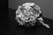 Greyscale closeup shot of the bride\'s bouquet on a table