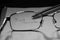 Greyscale closeup shot of eyeglasses on a notebook with the text just smile written on it