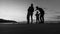 Greyscale image of a silhouetted family outdoors