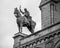 Greyscale shot of the statue of Louis IX on The Basilica of the Sacred Heart of Paris, France