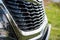 Grid of car. Radiator grille. Metal close-up texture background. Chrome grill of big powerful engine macro. Auto detail
