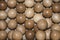 Grid of lots of wooden balls in a cardboard box
