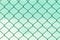 Grid metal wires on blurred green nylon background