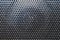 Grid pattern surface. dusty speaker mesh texture. perforated plastic. abstract background
