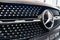 grid radiator and logo. a black Mercedes GLC car. luxury cars.