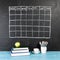 Grid timetable schedule on black chalkboard background.