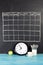 Grid timetable schedule on black chalkboard background.