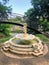 Grieving maiden sculpture fountain with the lovers bridge behind it, Old Odessa corner, Ukraine