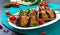 Griled meatballs with eggplant on skewers. Chicken kebab with vegetables. Diet meat dish