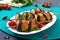 Griled meatballs with eggplant on skewers. Chicken kebab with vegetables. Diet meat dish