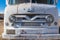 The grille of a white Ford Vanette abandoned in the desert in Nevada, USA - November 17, 2017