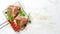 Grilled aged T-bone steak with rosemary on a white wooden background. Top view. Rustic style