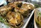 Grilled artichokes on a plate. Traditional cuisine of Naples, Italy.