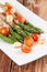 Grilled asparagus with prosciutto, mozzarella and cherry tomatoes