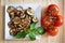 Grilled aubergines with basil and tomatoes