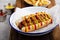 Grilled bacon wrapped hot dog