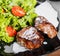 Grilled beaf steak meat with fresh vegetable salad and tomatoes