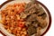 Grilled beef meat kofta and liver with classic ring pasta macaroni with tomato sauce and pieces, garlic, onion, spices, oil and