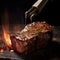 Grilled beef steak medium rare on fire over flaming grill with smoke and flames on black background