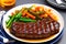 Grilled beef steak with vegetable on the flaming grill