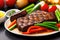 Grilled beef steak with vegetable on the flaming grill