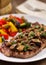 Grilled beefsteak with mushrooms and mixed vegetables.