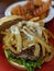 grilled bison meat burger sandwich and sweet potato waffle fries