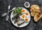 Grilled bread, canned sardines, boiled eggs, micro greens on a dark background, top view. Delicious breakfast, tapas, appetizers