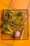 Grilled Broccolini Sprouts with garlic. Orange background. Top view