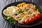 Grilled calamari with tentacles with tomatoes, broccoli, lemon a