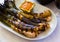 Grilled Calcots onions with Romesco sauce