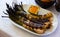 Grilled calcots with romesco sauce